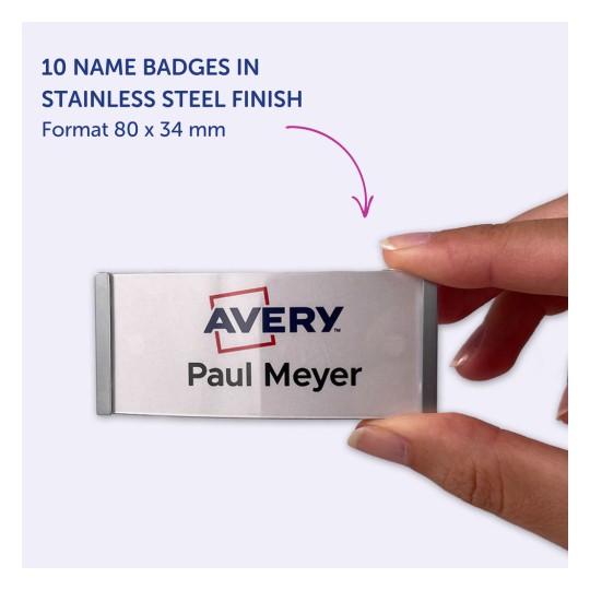 Slika prikazuje 10 oznaka imena u inox završnici, s logom 'Avery' i imenom 'Paul Meyer'. Oznake se drže u ruci osobe.