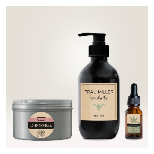 Slika prikazuje tri proizvoda: mirisnu svijeću u metalnom spremniku, sapun za ruke u crnoj pumpici s natpisom 'FRAU MILLER handseife' i bočicu s kapaljkom od jantara s natpisom 'AROMAÖL HANF'.