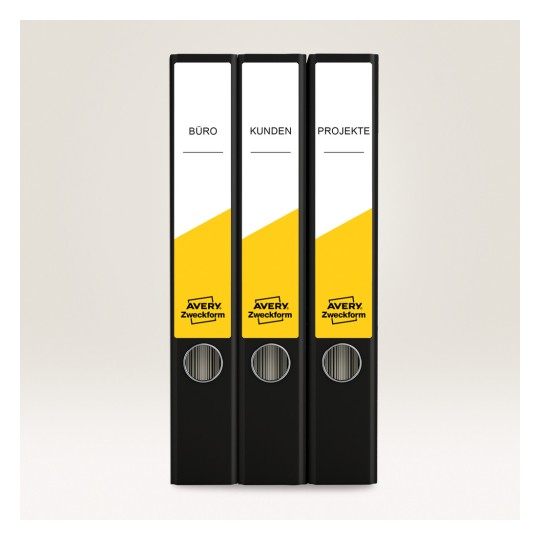 Slika prikazuje tri crne registratore uredno poredane, označene kao 'BÜRO', 'KUNDEN' i 'PROJEKTE' s kombinacijom žute i crne boje i markom 'AVERY Zweckform'.
